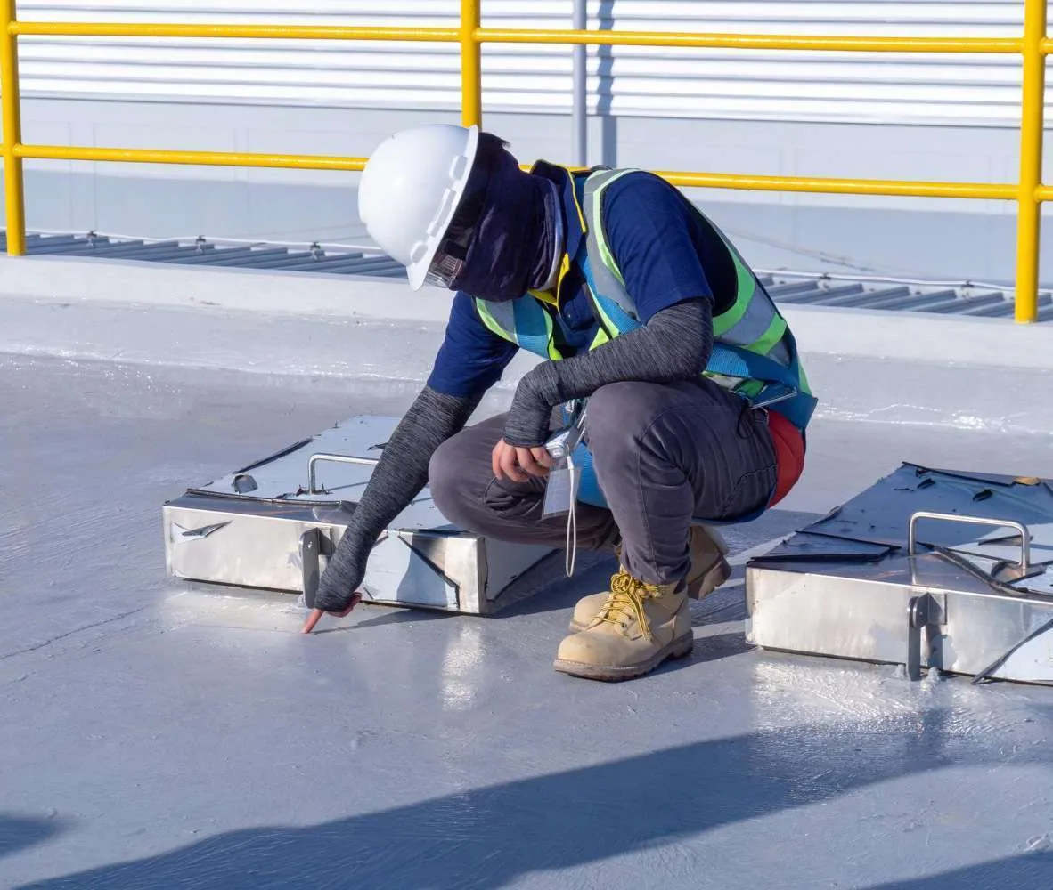 Technician checking a commercial roof